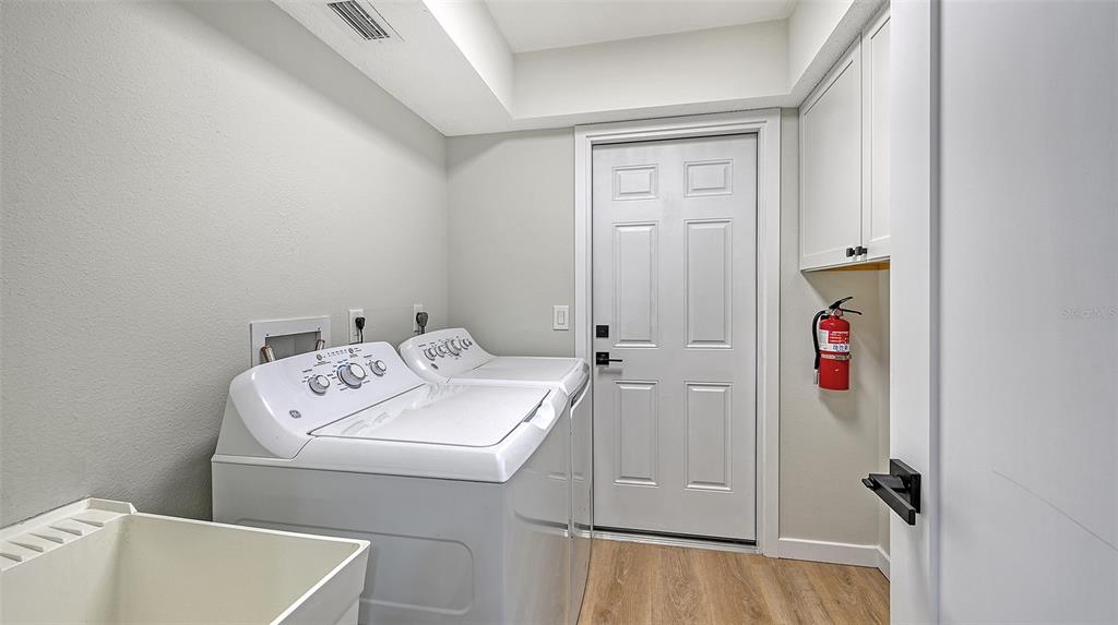 3924 Helene Street Sarasota, FL 34233 - Photo 42 of 53 a utility room with dryer and washer