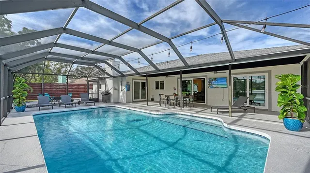a view of a patio with table and chairs