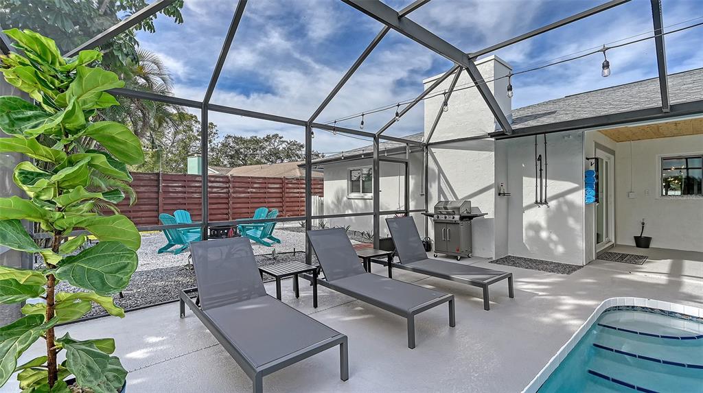 3924 Helene Street Sarasota, FL 34233 - Photo 47 of 53 a view of a patio with a table and chairs