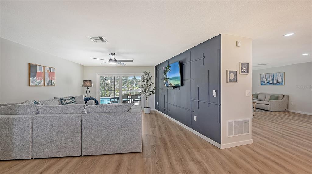 3924 Helene Street Sarasota, FL 34233 - Photo 8 of 53 a living room with furniture and a flat screen tv