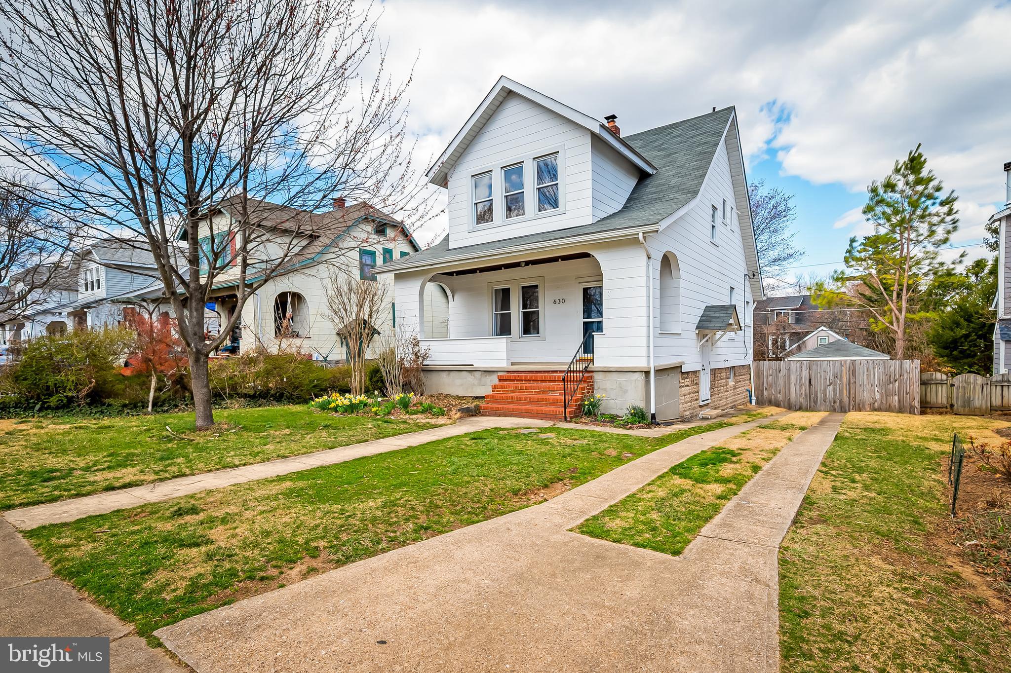 630 Dunkirk Road Baltimore, MD 21212 - Photo 1 of 36 a front view of a house with a yard and trees