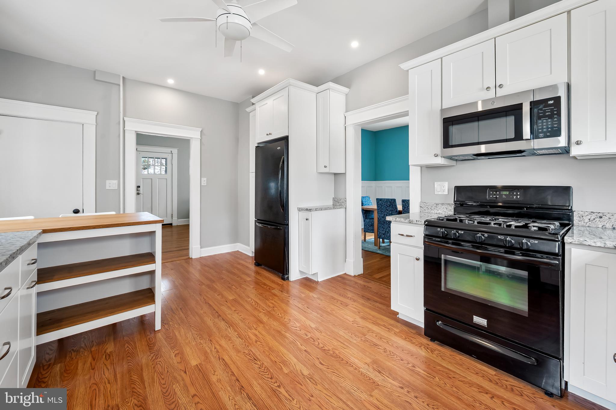 630 Dunkirk Road Baltimore, MD 21212 - Photo 11 of 36 a kitchen with stainless steel appliances a stove a microwave and cabinets