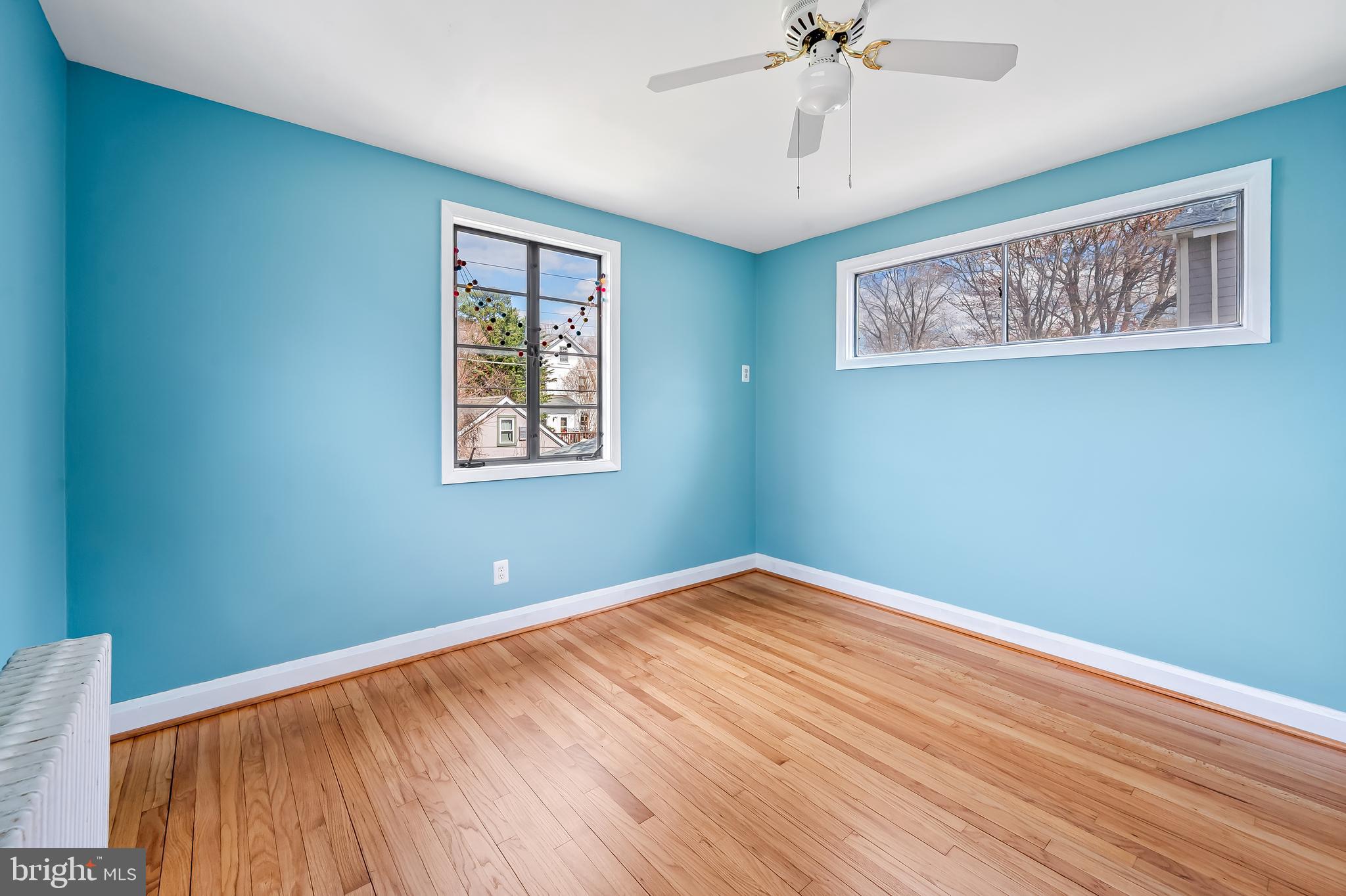 630 Dunkirk Road Baltimore, MD 21212 - Photo 12 of 36 a view of a big room with wooden floor and windows