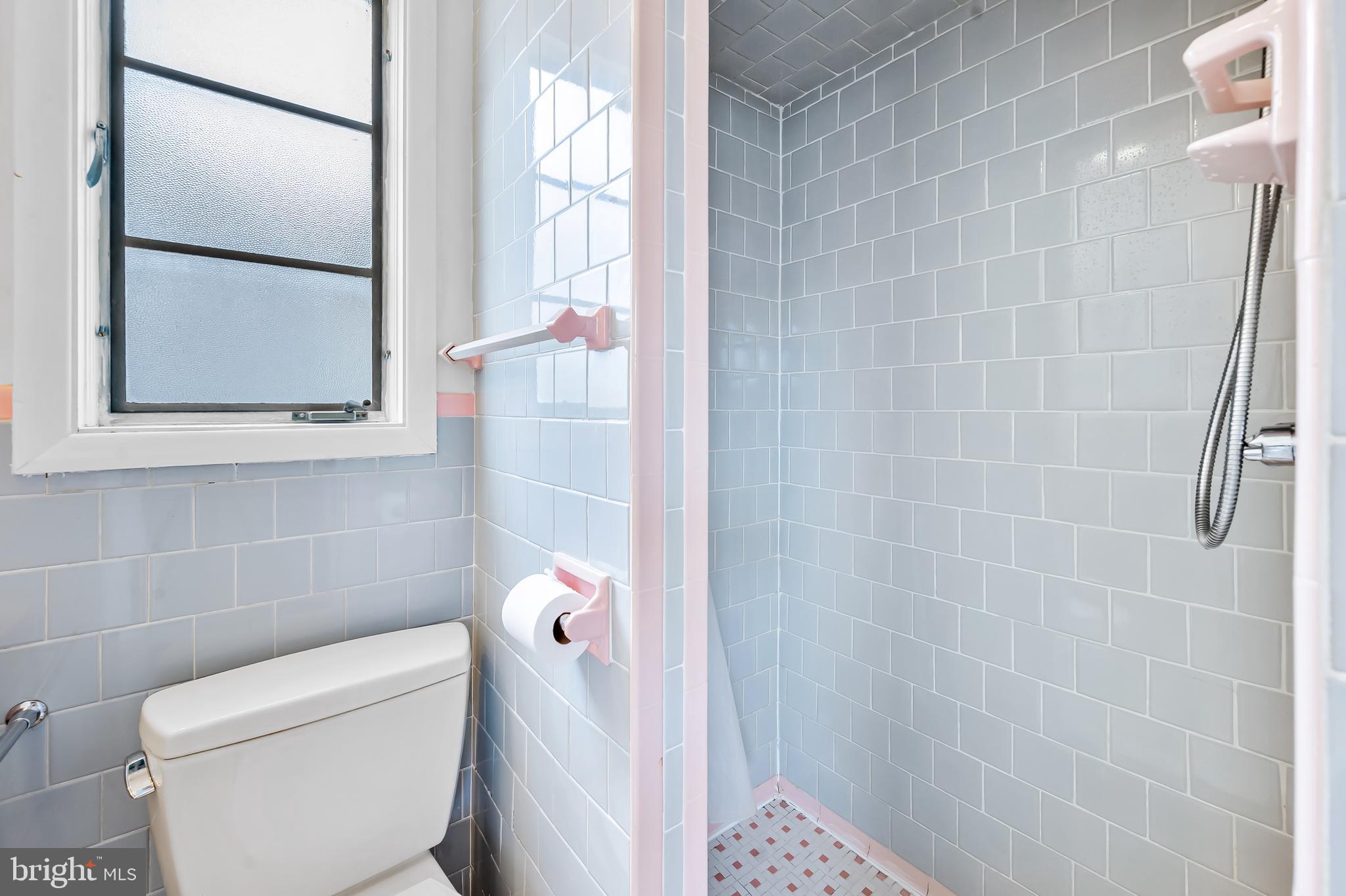 630 Dunkirk Road Baltimore, MD 21212 - Photo 15 of 36 a bathroom with a toilet and a shower