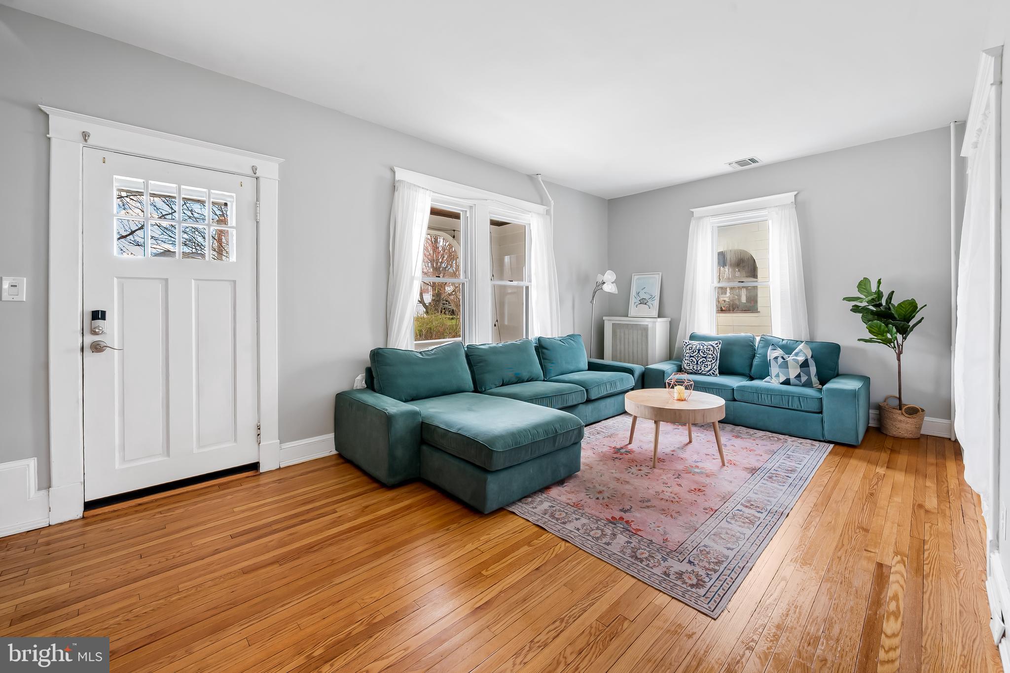630 Dunkirk Road Baltimore, MD 21212 - Photo 2 of 36 a living room with furniture and a wooden floor