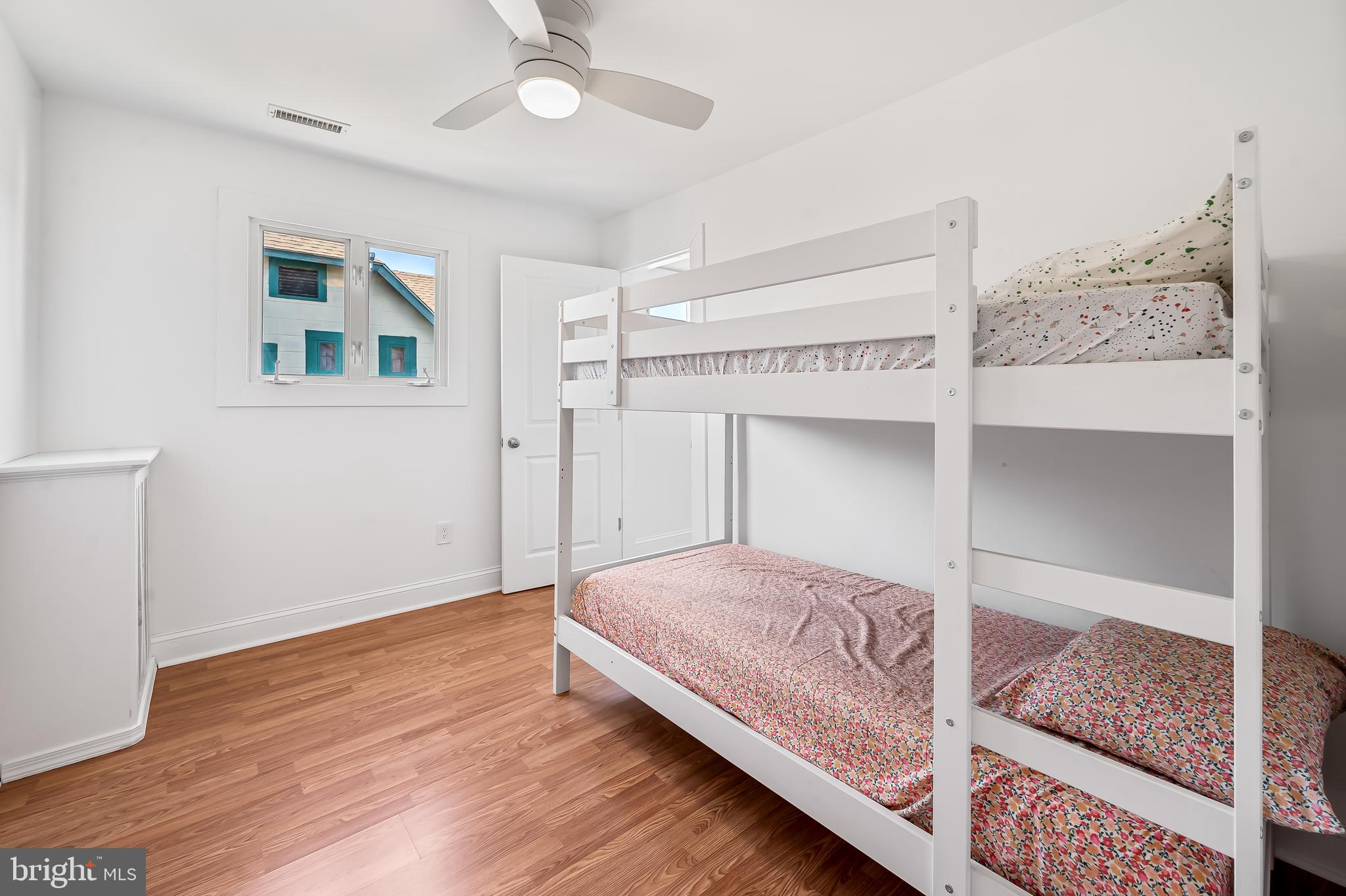 630 Dunkirk Road Baltimore, MD 21212 - Photo 23 of 36 a bedroom with a large bed and a window