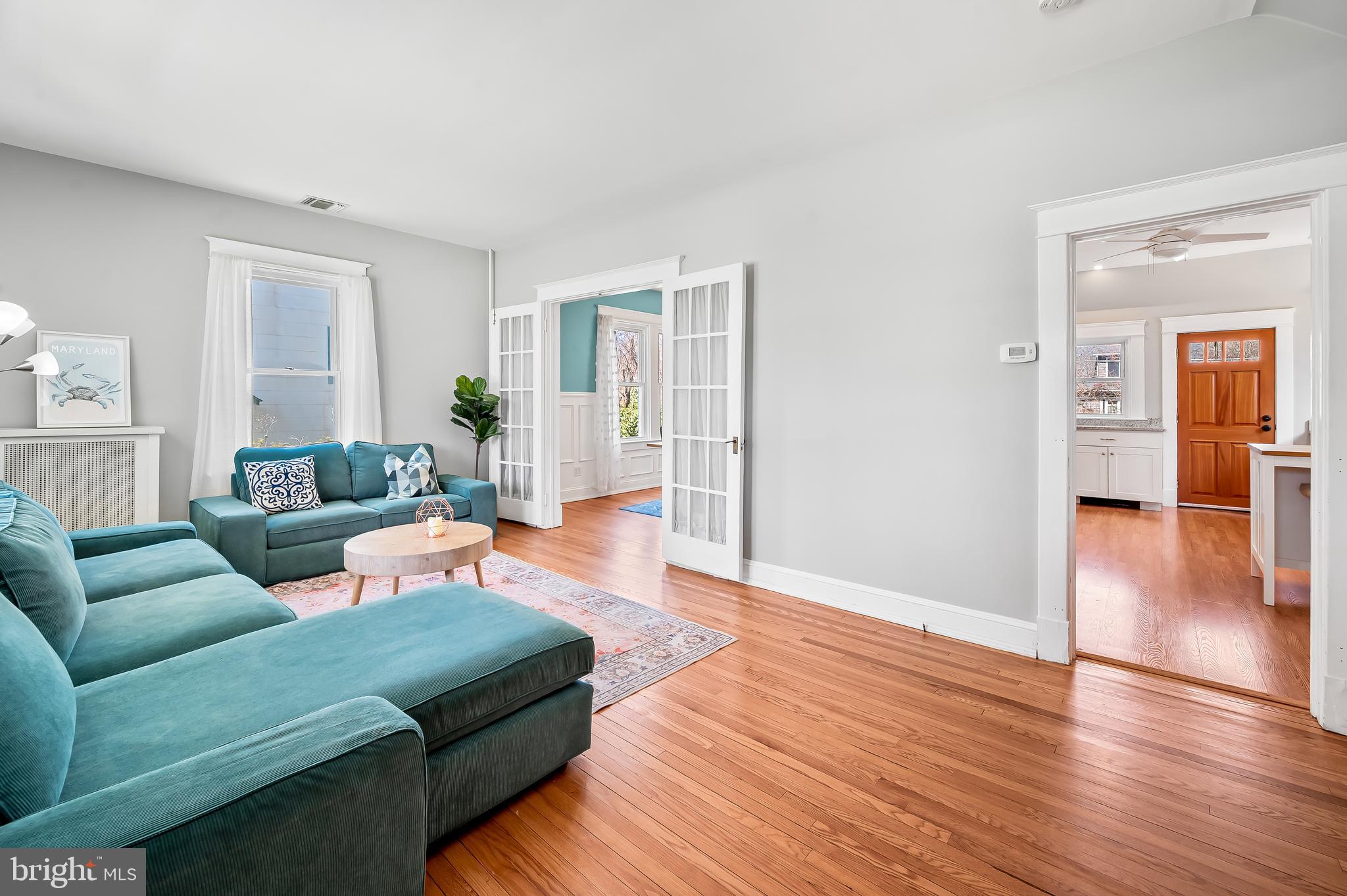 630 Dunkirk Road Baltimore, MD 21212 - Photo 3 of 36 a living room with furniture and a wooden floor