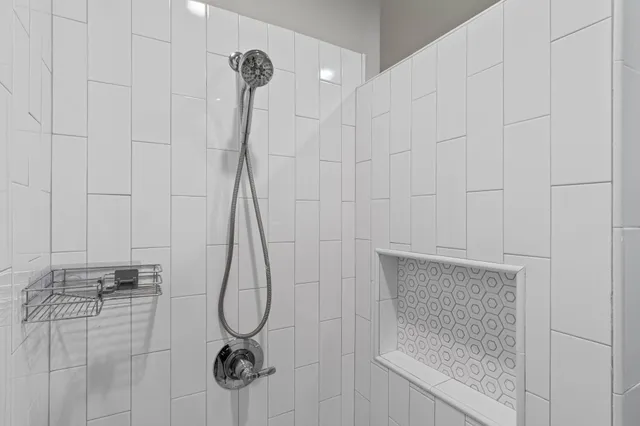 a view of a room with shelf on the wall