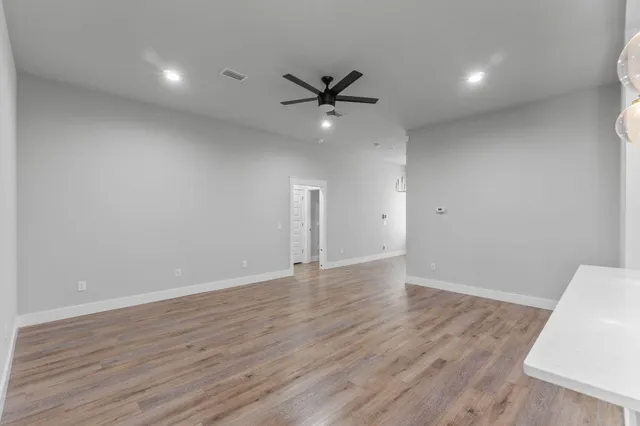a kitchen with stainless steel appliances a refrigerator sink and microwave