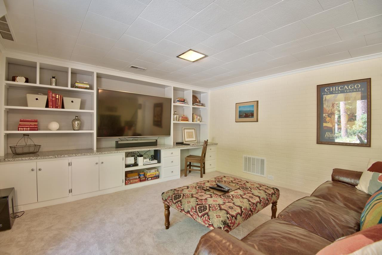 1207 Woodburn Road Durham, NC 27705 - Photo 17 of 25 ...with space for a honkin' big flatscreen TV & all your favorite electronics, family games, and books! Built-In Bookcases...