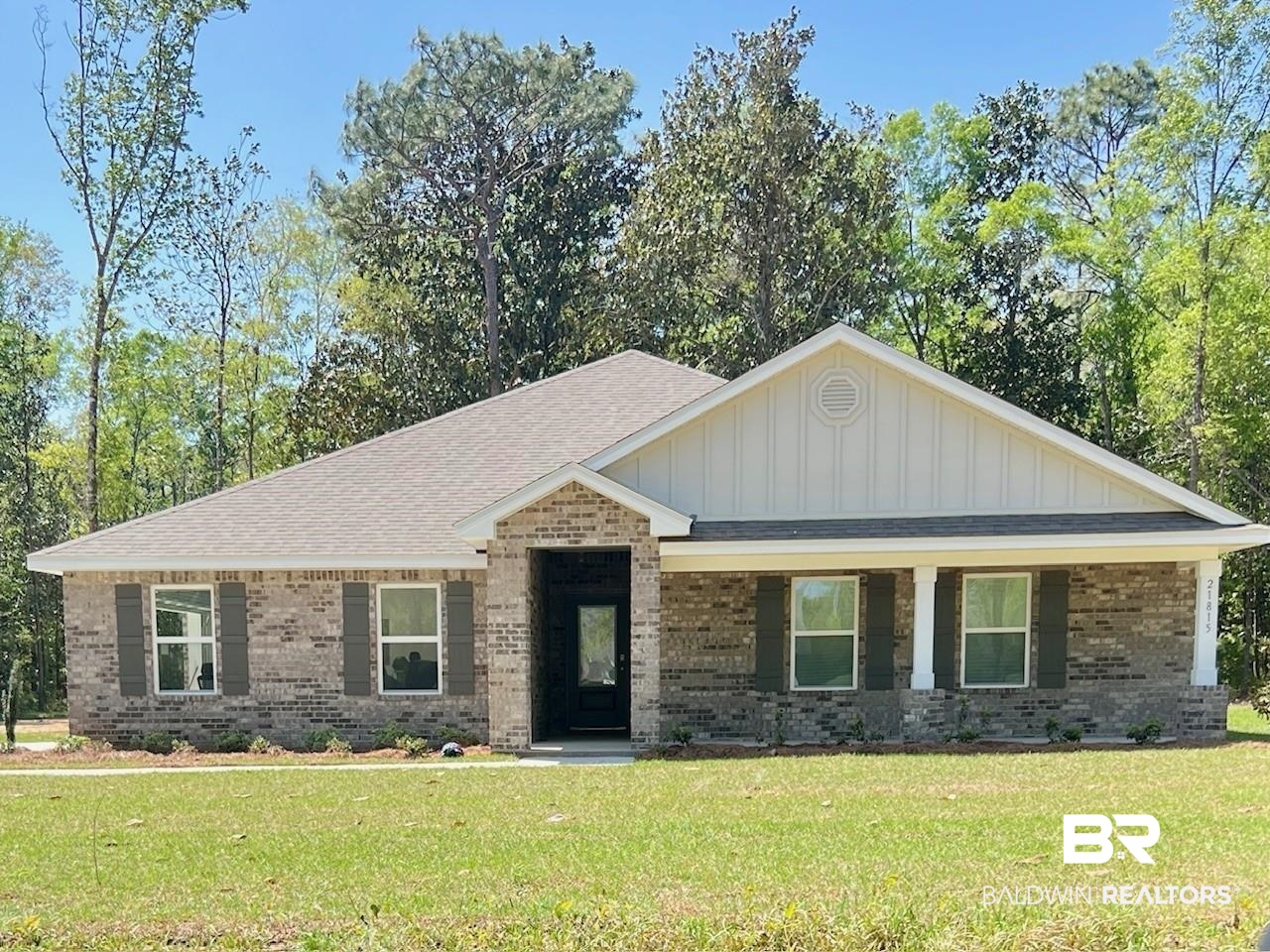21815 Sedlack Road Silverhill, AL 36576 - Photo 1 of 27 View of front of property with brick siding, a shingled roof, a front lawn, and board and batten siding