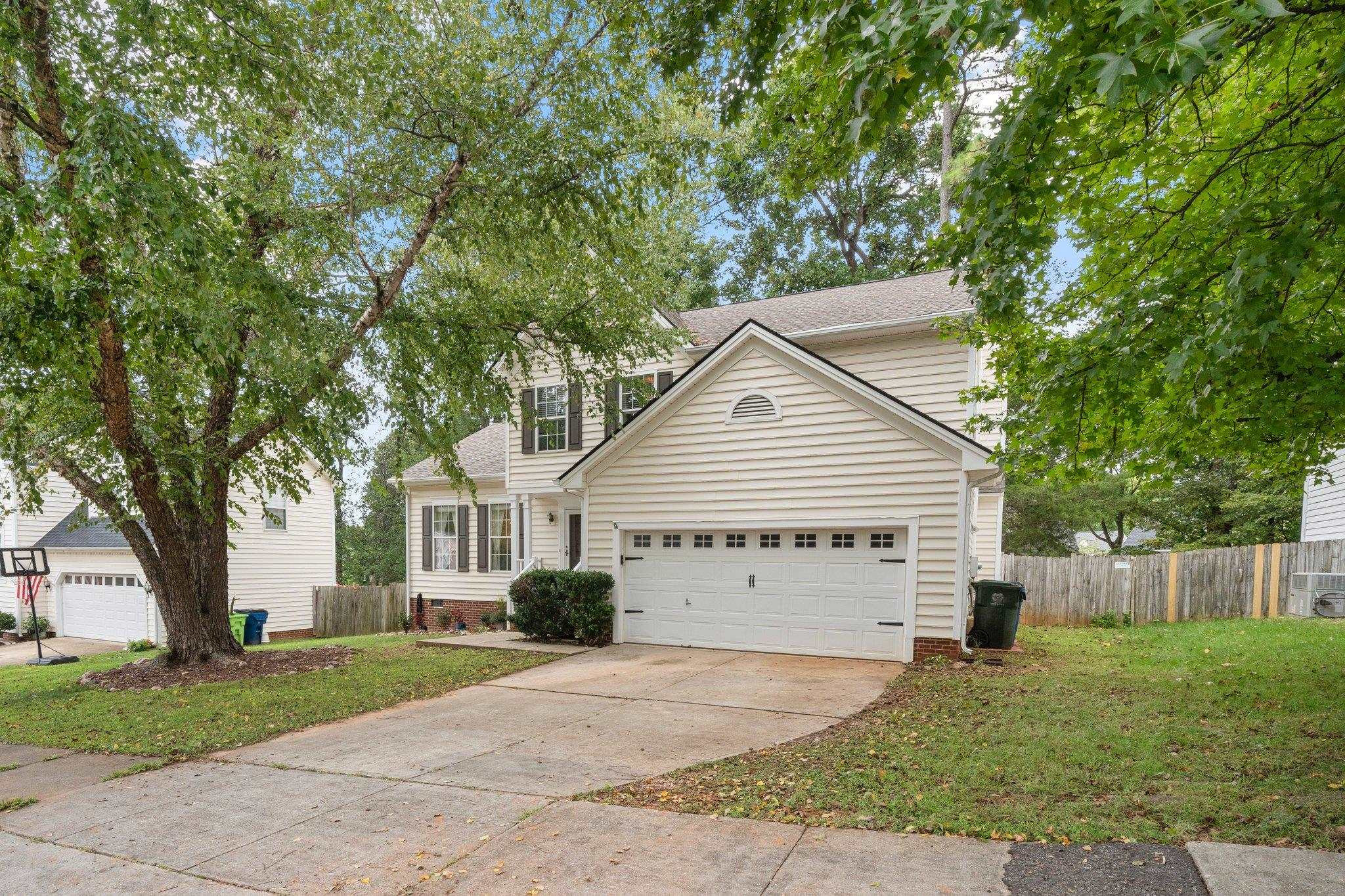 8813 Harps Mill Road Raleigh, NC 27615 - Photo 1 of 28 front view of a house with a yard