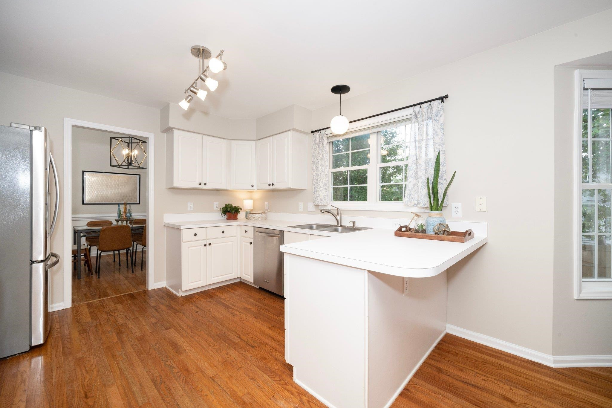 8813 Harps Mill Road Raleigh, NC 27615 - Photo 11 of 28 a kitchen with a sink stove and refrigerator