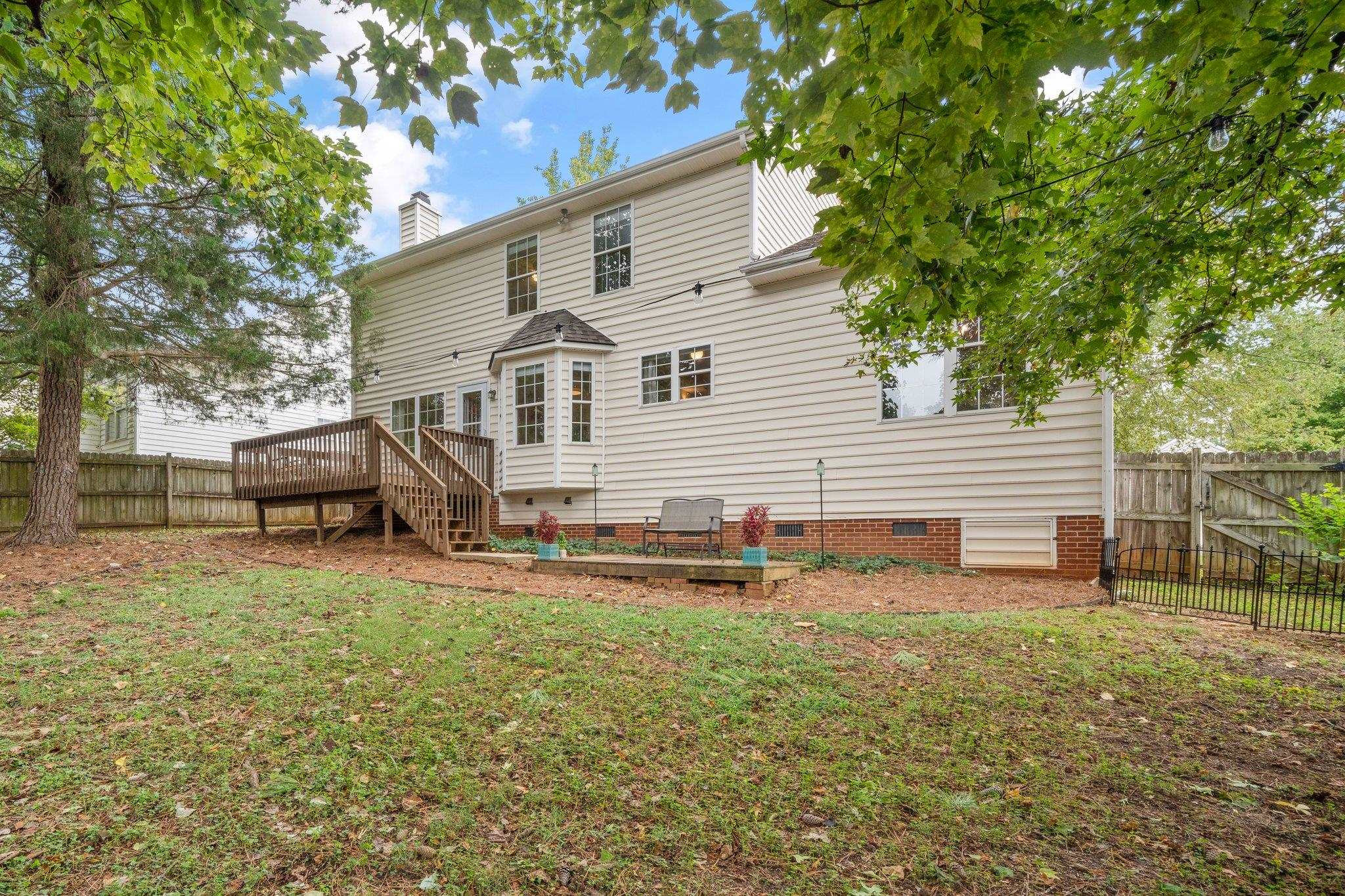8813 Harps Mill Road Raleigh, NC 27615 - Photo 28 of 28 a view of a house with a yard