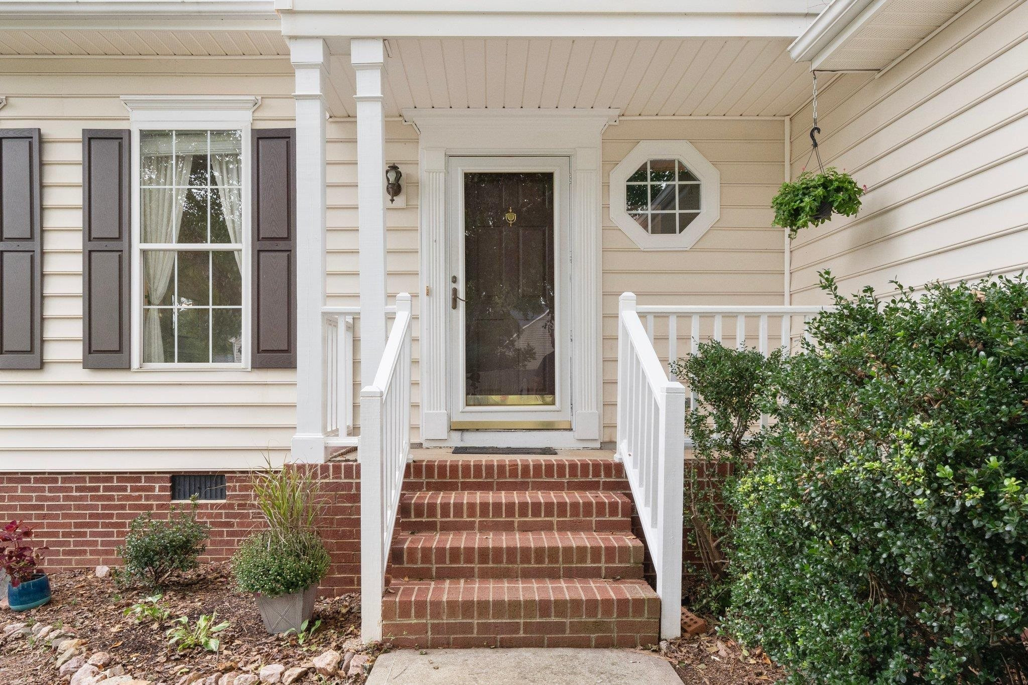 8813 Harps Mill Road Raleigh, NC 27615 - Photo 4 of 28 a front view of a house with a yard