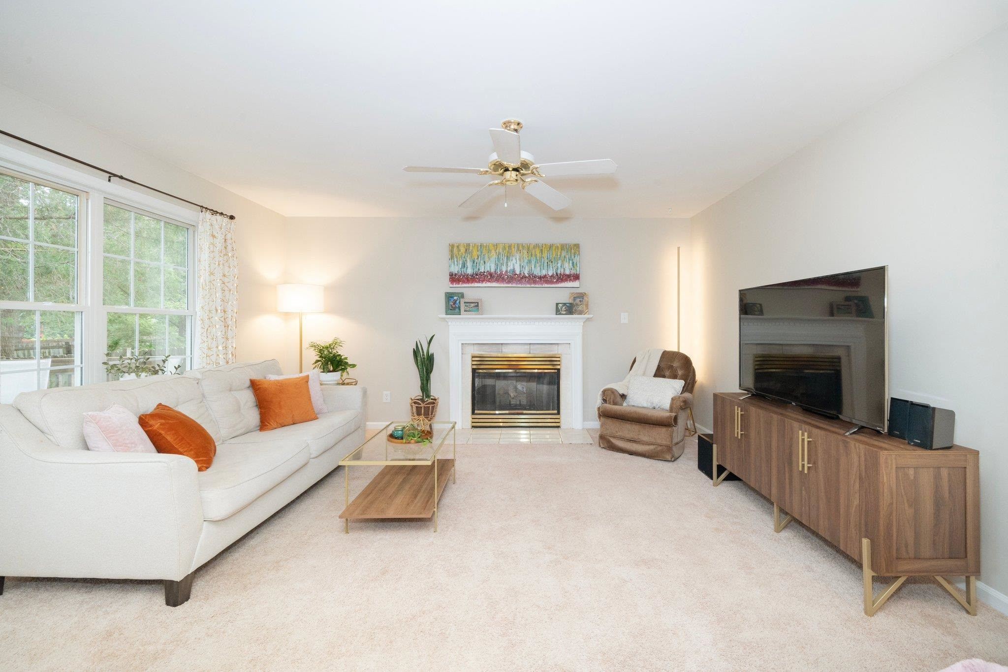 8813 Harps Mill Road Raleigh, NC 27615 - Photo 8 of 28 a living room with furniture and a flat screen tv