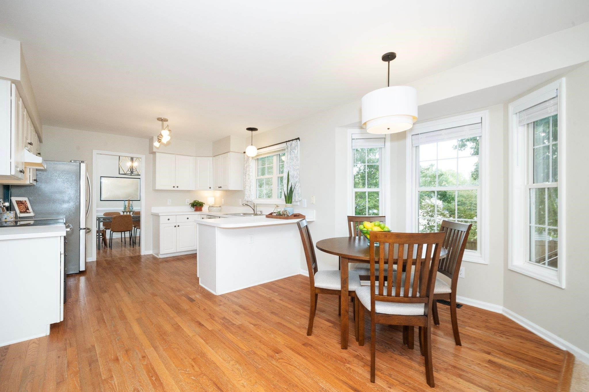 8813 Harps Mill Road Raleigh, NC 27615 - Photo 10 of 28 a view of a dining room with furniture window and wooden floor