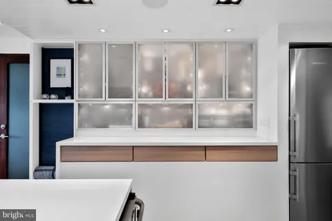 a kitchen with stainless steel appliances granite countertop a stove and a sink