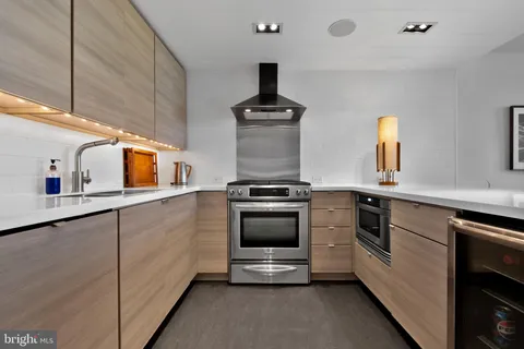 a living room with furniture a flat screen tv and a window