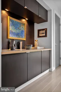 a living room with furniture rug and wooden floor