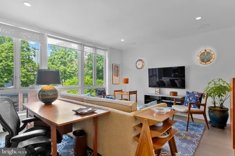 a bedroom with a bed and a lamp