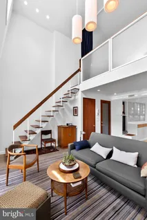a kitchen with sink a stove and cabinets