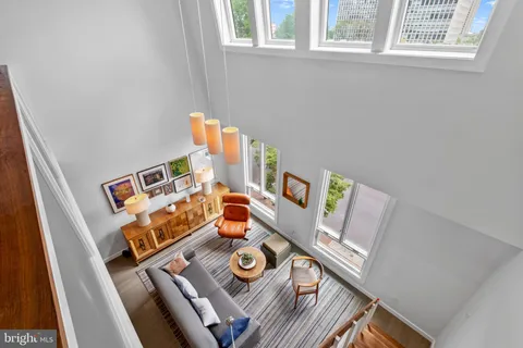 a view of a livingroom with furniture and a flat screen tv