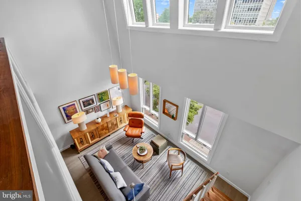 a view of a livingroom with furniture and a flat screen tv