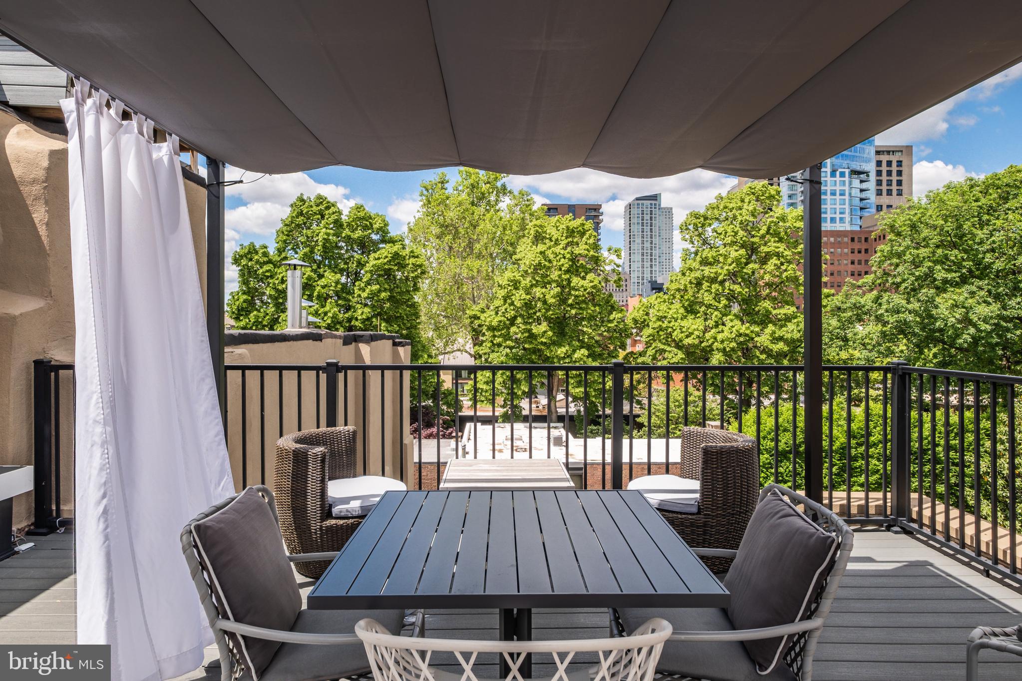 256 South 3rd Street Philadelphia, PA 19106 - Photo 47 of 72 a view of balcony with furniture and wooden deck