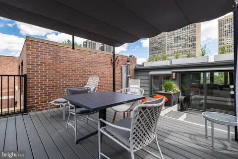 a view of a brick house with large windows
