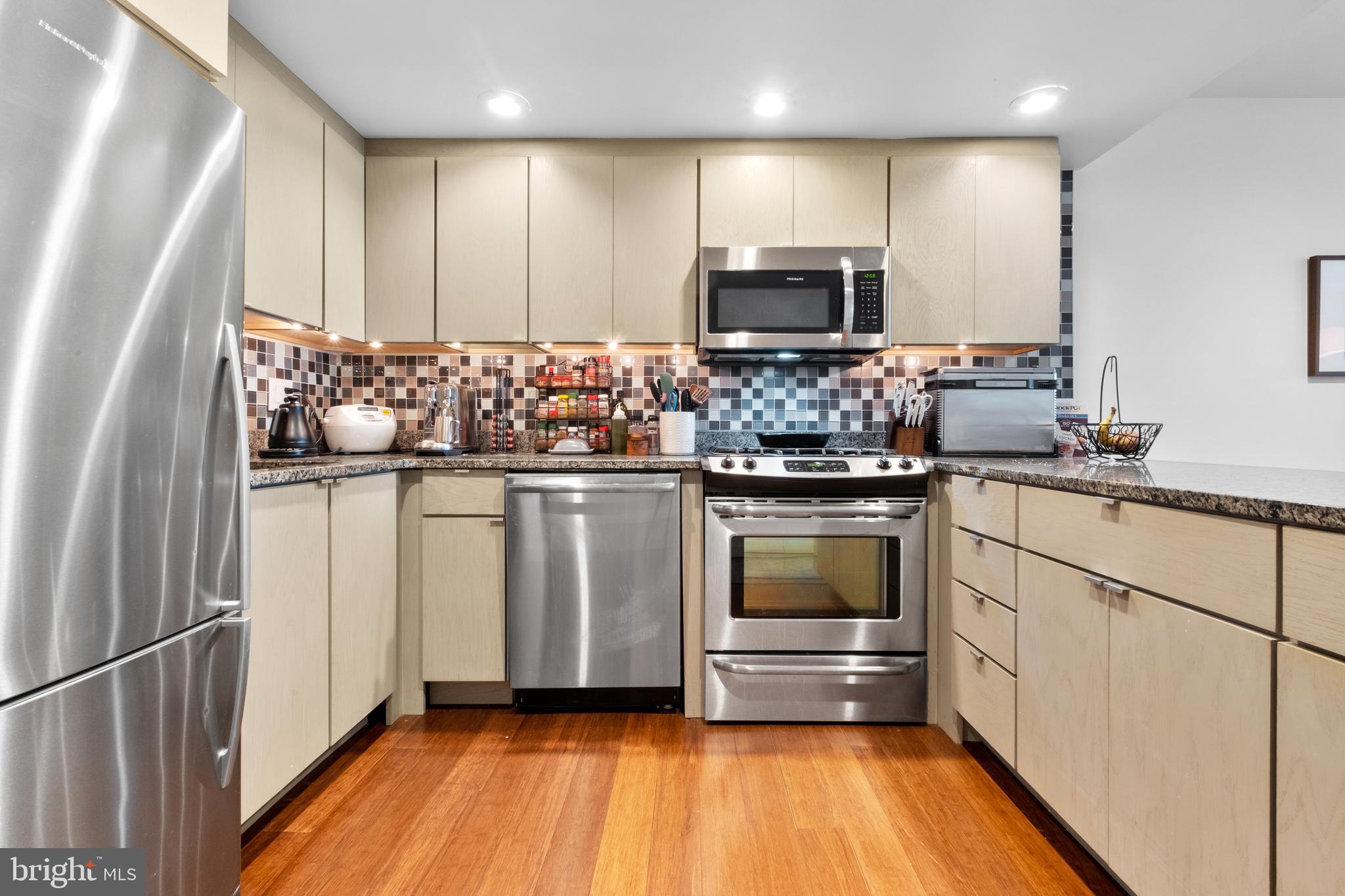 256 South 3rd Street Philadelphia, PA 19106 - Photo 51 of 72 a kitchen with white cabinets and appliances