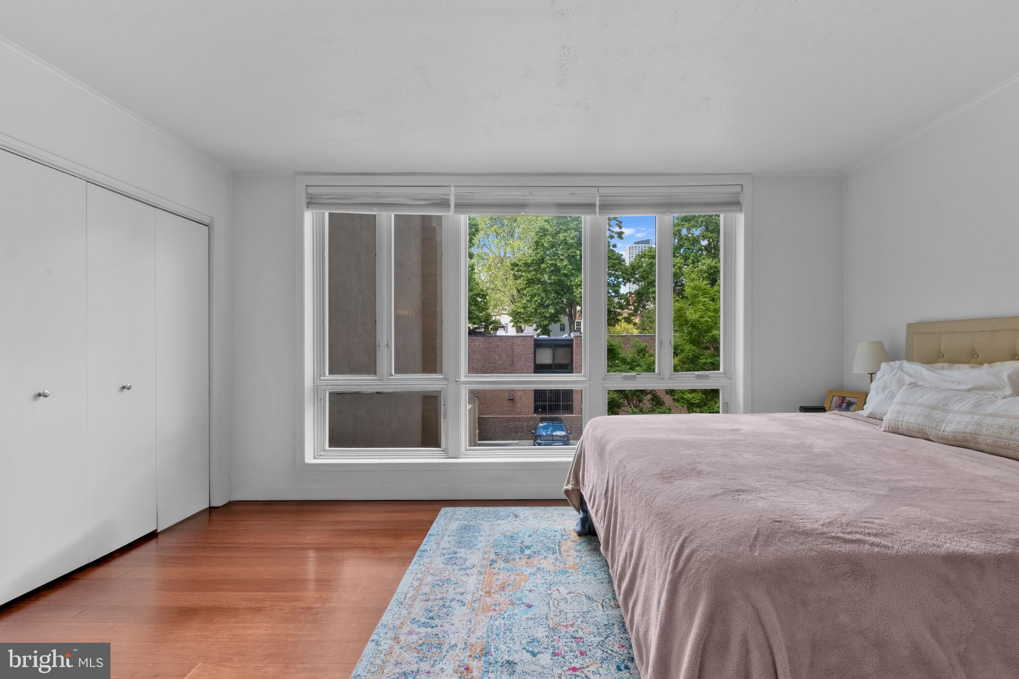 256 South 3rd Street Philadelphia, PA 19106 - Photo 64 of 72 a bedroom with a bed and glass window