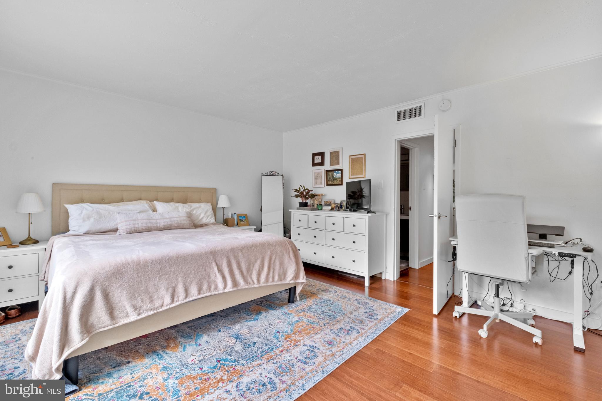 256 South 3rd Street Philadelphia, PA 19106 - Photo 66 of 72 a bedroom with a bed and wooden floor