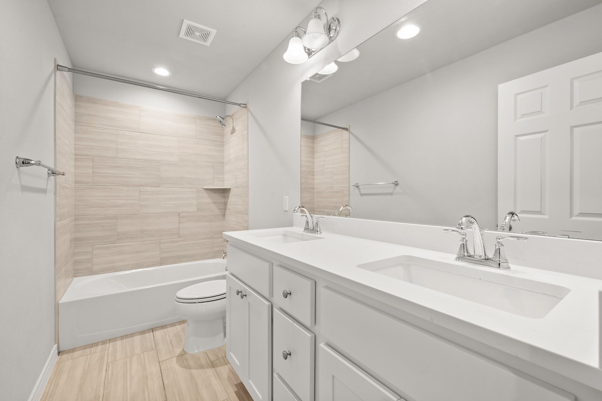 5107 Lemon Tree Path, Unit 127 Austin, TX 78723 - Photo 31 of 40 a bathroom with a sink a toilet and a large mirror
