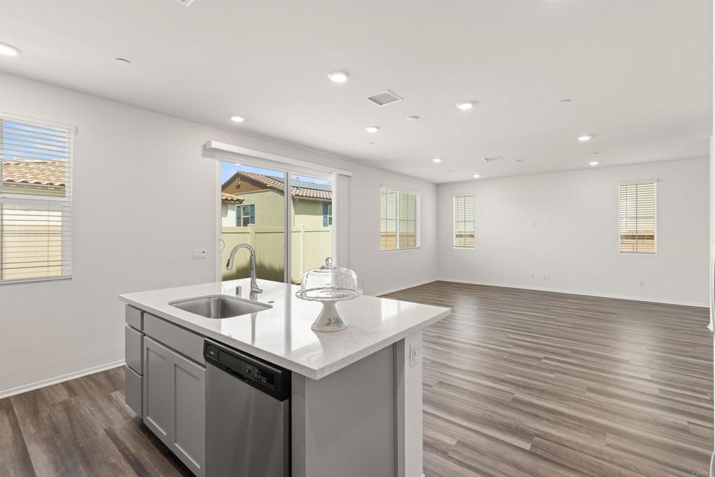 895 Brookdale Drive Vista, CA 92081 - Photo 14 of 45 a kitchen with sink and mirror