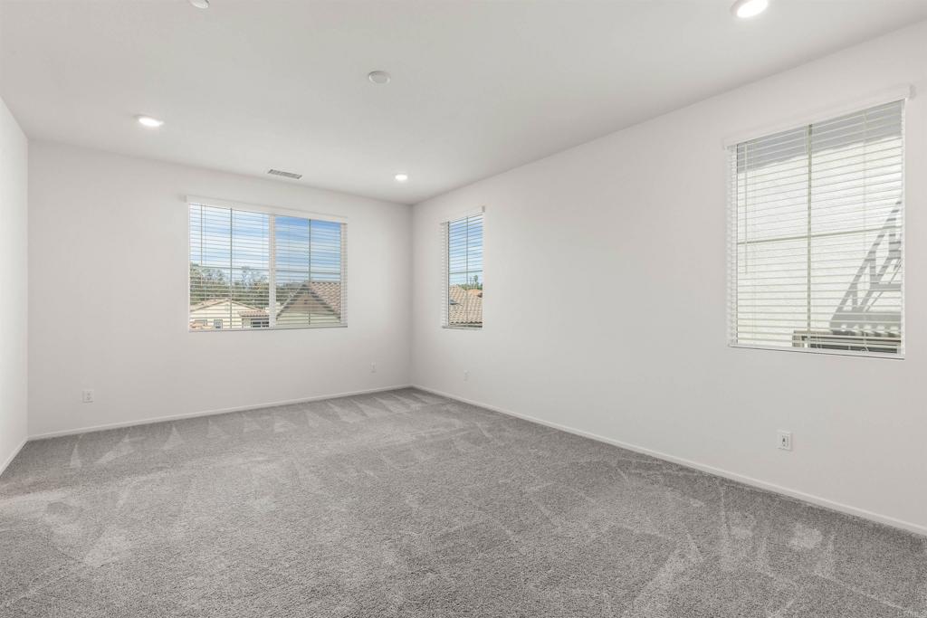 895 Brookdale Drive Vista, CA 92081 - Photo 16 of 45 an empty room with windows