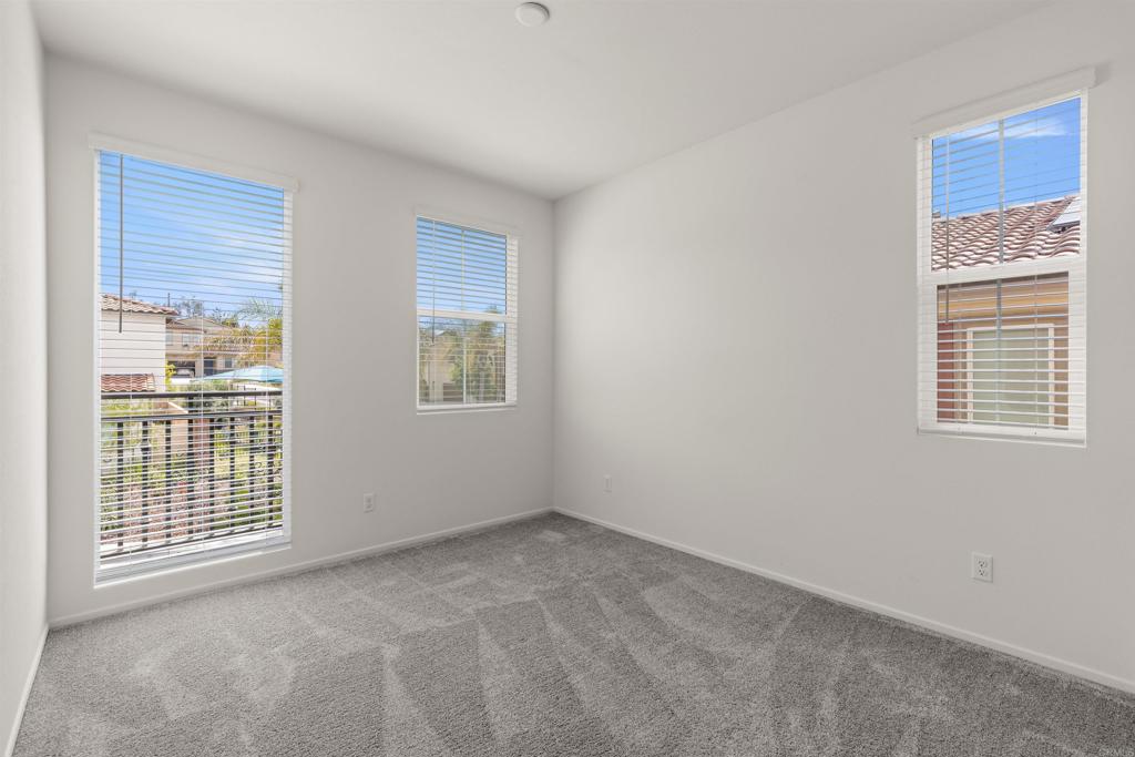 895 Brookdale Drive Vista, CA 92081 - Photo 26 of 45 an empty room with windows