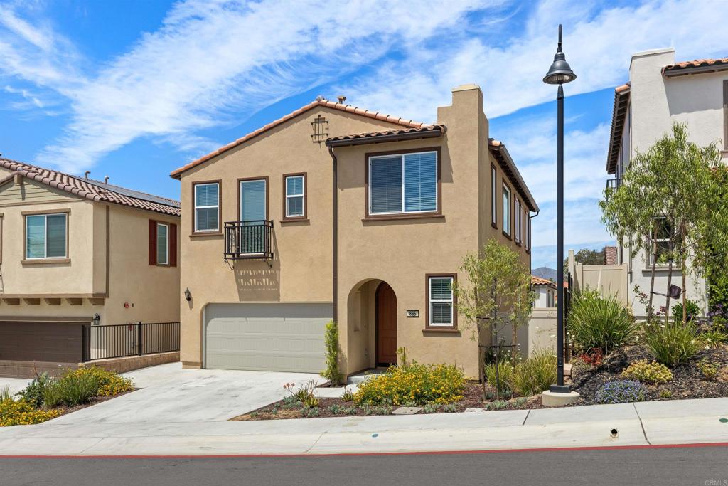895 Brookdale Drive Vista, CA 92081 - Photo 3 of 45 a front view of a house with garden