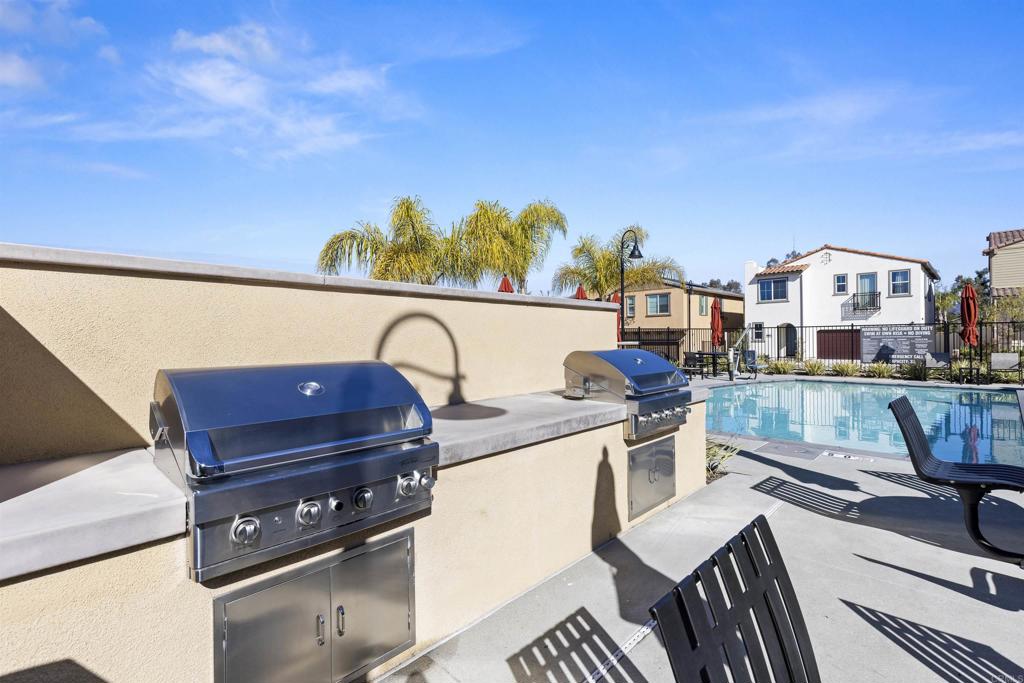 895 Brookdale Drive Vista, CA 92081 - Photo 40 of 45 a view of a balcony with two chairs and a stove