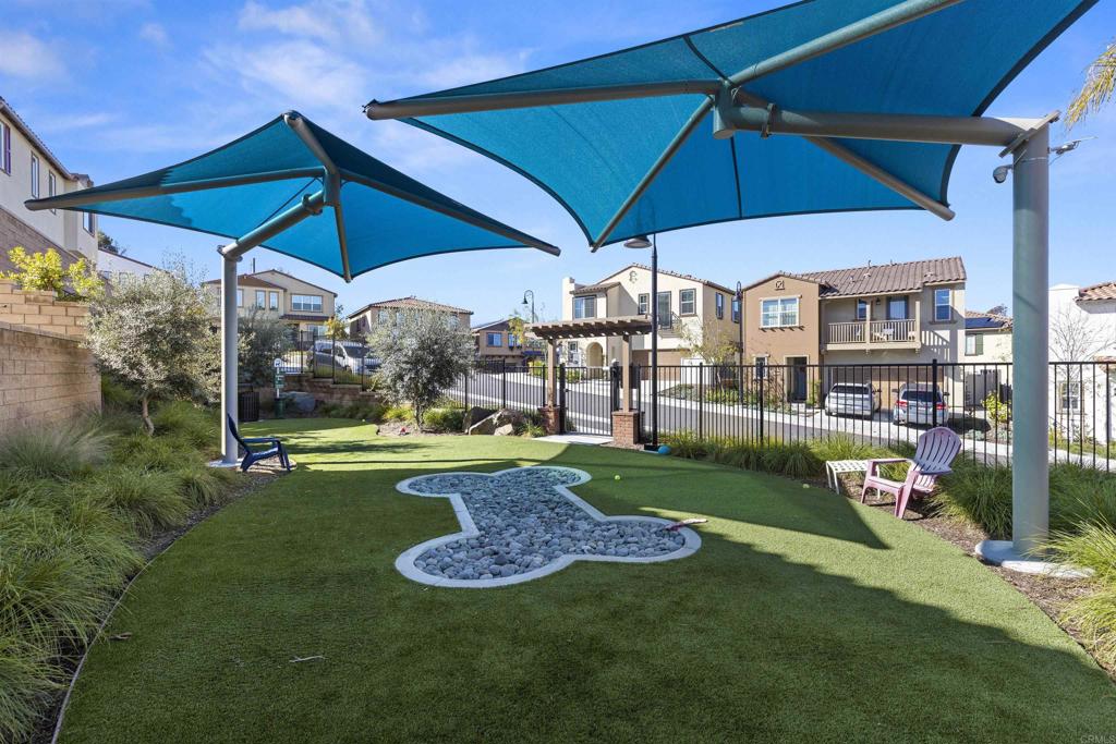 895 Brookdale Drive Vista, CA 92081 - Photo 41 of 45 a view of a table and chairs under an umbrella
