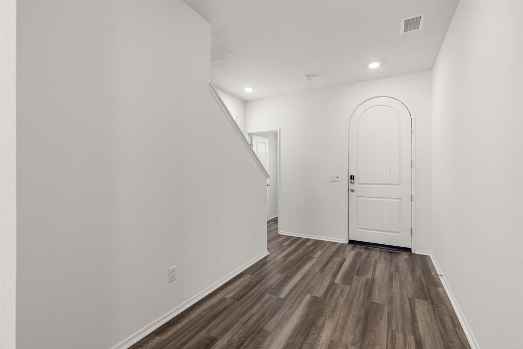 895 Brookdale Drive Vista, CA 92081 - Photo 5 of 45 a view of a room with wooden floor and white walls