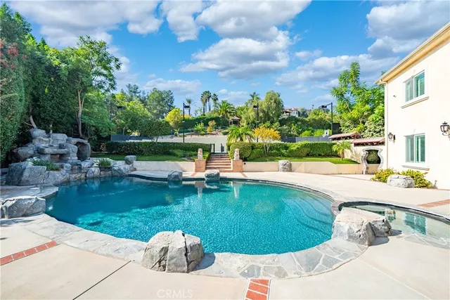 a front view of a house with a yard and pathway