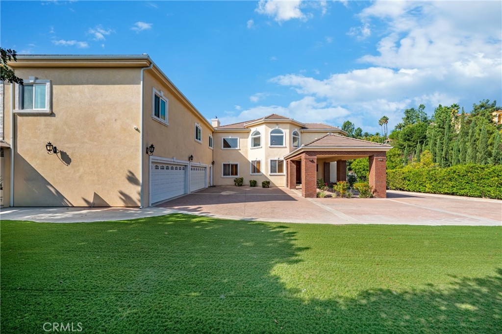 19910 Tennessee Trail Walnut, CA 91789 - Photo 17 of 70 a front view of a house with a yard and pathway