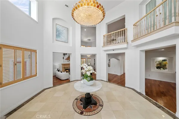 a view of living room with furniture and a fireplace