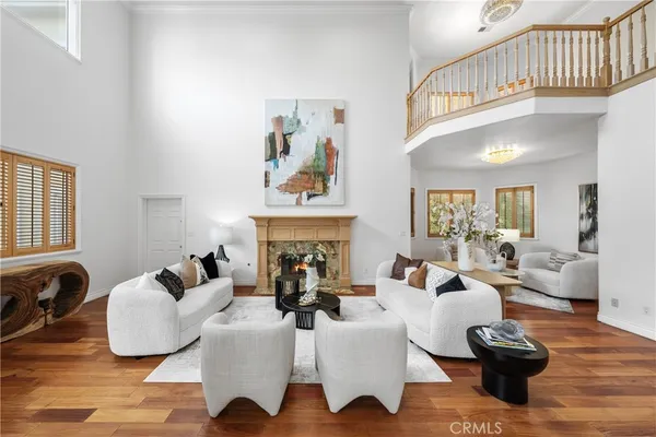 a dining room with furniture a rug and a large mirror