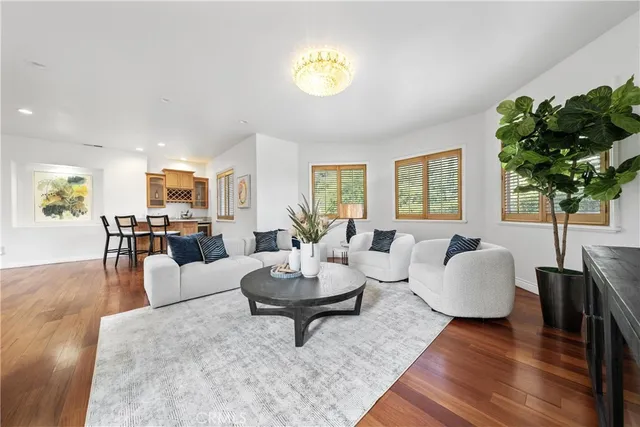 a view of a dining room with furniture and a chandelier