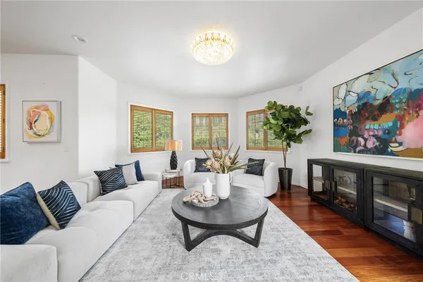 a large kitchen with kitchen island granite countertop a large window and stainless steel appliances