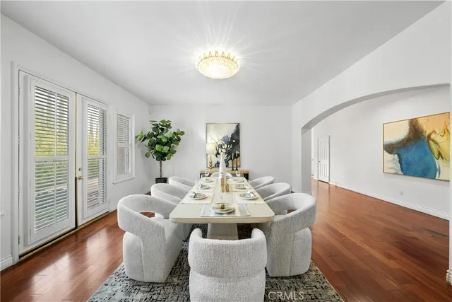 a bathroom with a granite countertop sink toilet a mirror and shower