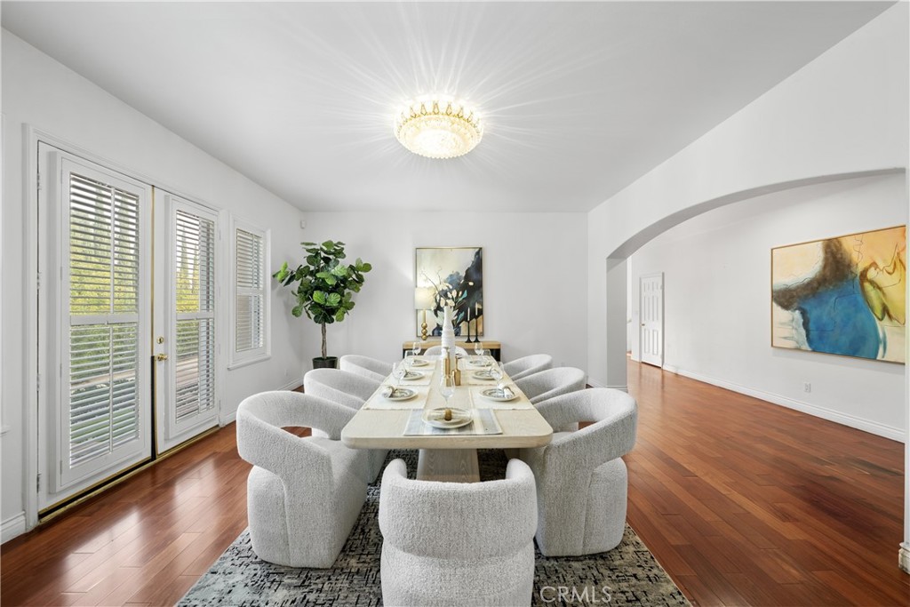 19910 Tennessee Trail Walnut, CA 91789 - Photo 28 of 70 a dining room with furniture potted plants and wooden floor