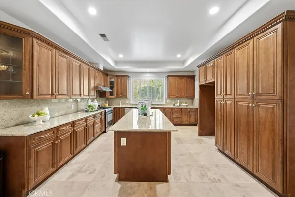 a spacious bedroom with a bed and a large window